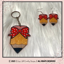 Load image into Gallery viewer, Pencil With Bow - Badge Reel, Magnet, Keychain, Lanyard, Earrings, Car Charm