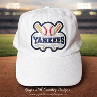 New York Yankees inspired baseball hat front view on stadium field background, embroidered patch detail sports cap