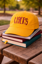 Load image into Gallery viewer, Gold Tigers hat with maroon embroidery on a stack of books
